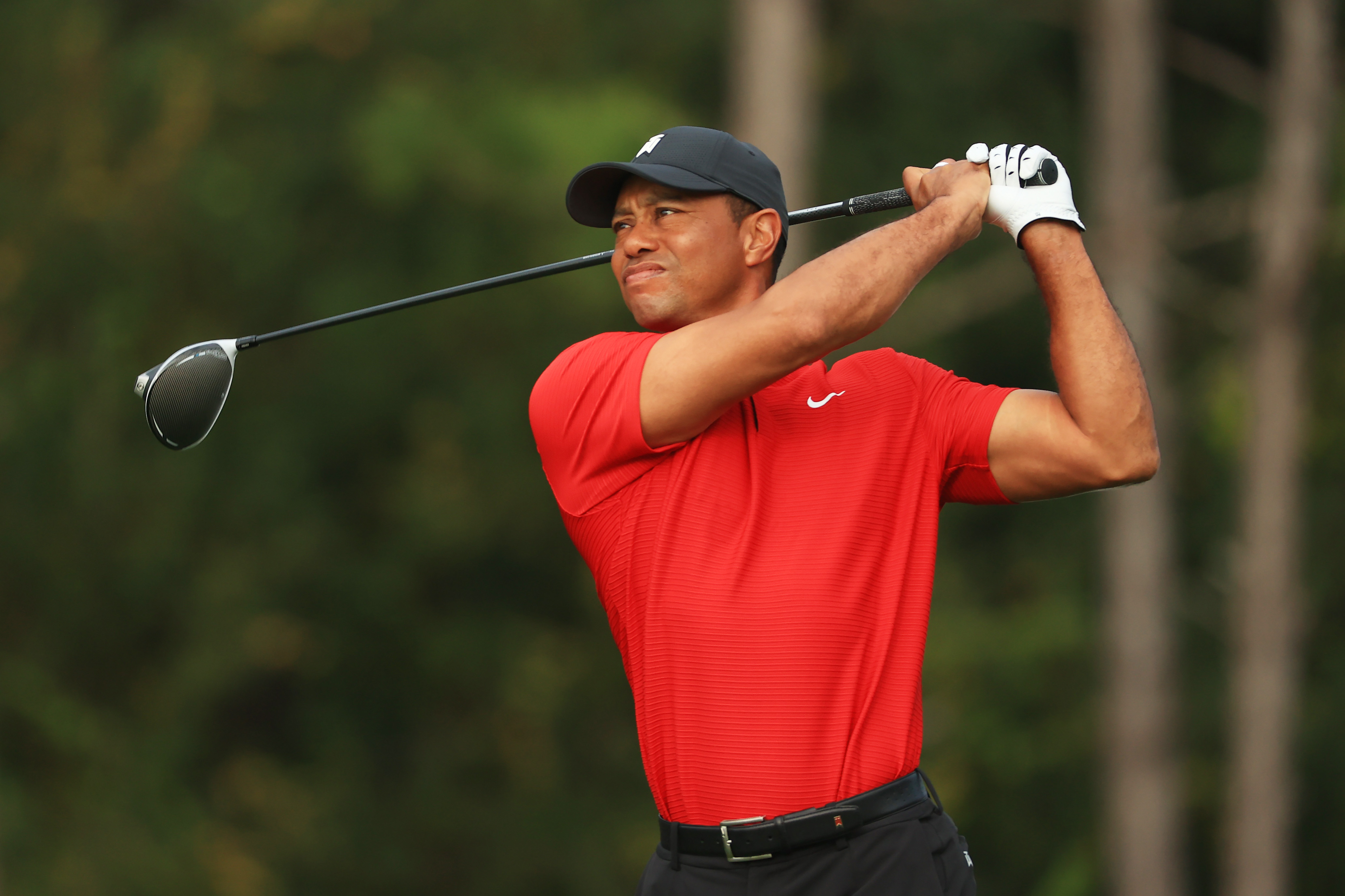 Tiger Woods plays his shot from the second tee during the final round of the PNC Championship at the Ritz-Carlton Golf Club Orlando on Dec. 20, 2020 in Orlando, Florida. (Mike Ehrmann/Getty Images)