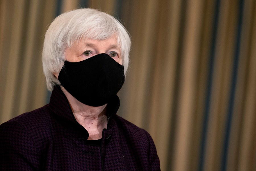 Treasury Secretary Janet Yellen listens to President Joe Biden as he delivers remarks on the national economy and the need for his administration's proposed $1.9 trillion coronavirus relief legislation in the State Dining Room at the White House on February 05, 2021 in Washington, DC. (Stefani Reynolds-Pool/Getty Images)