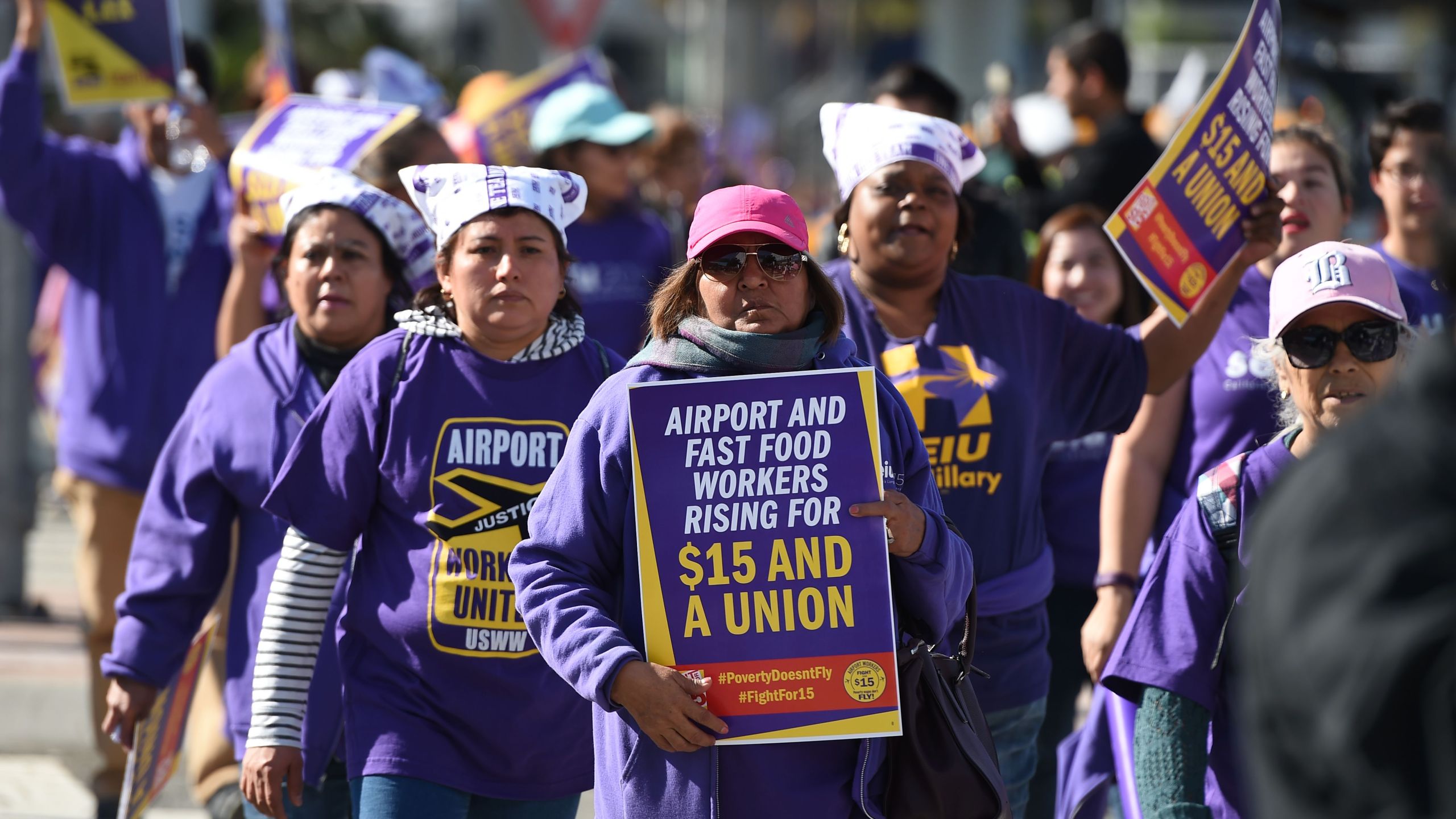 Union workers and supporters participate in a "Fight for $15" wage protest at Los Angeles International Airport in Los Angeles, on Nov. 29, 2016. Workers from fast-food chains, airports and other service industries rallied in U.S. cities as part of a nationwide day of disruption to demand union rights and a minimum wage of $15 an hour. Workers joining in included cabin cleaners, luggage handlers and other staff at O'Hare, Los Angeles and Fort Lauderdale airports. However, flights were not expected to be disrupted. (Robyn Beck /AFP via Getty Images)