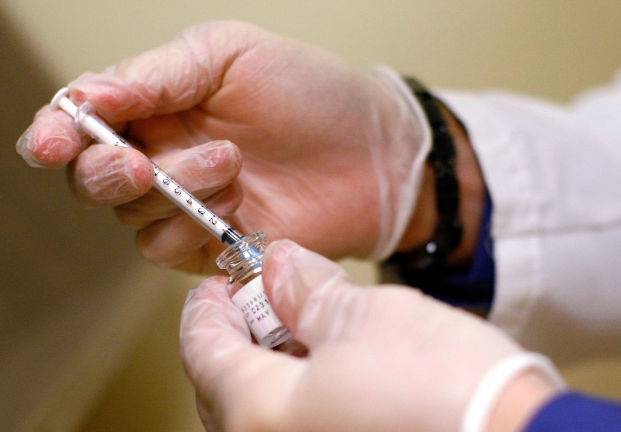 ARLINGTON, VA - JUNE 05: Dr. Shannon Ginnan measure out a Botox injection during an event called the "The Botox Bailout" where the first 50 recently laid-off workers could exchange their resumes for free Botox injections June 5, 2009 in Arlington, Virginia. The event, which took place in a Reveal store, also featured recruiters to help job seekers network, collect resumes and offer on-site interviews. (Photo by Win McNamee/Getty Images)