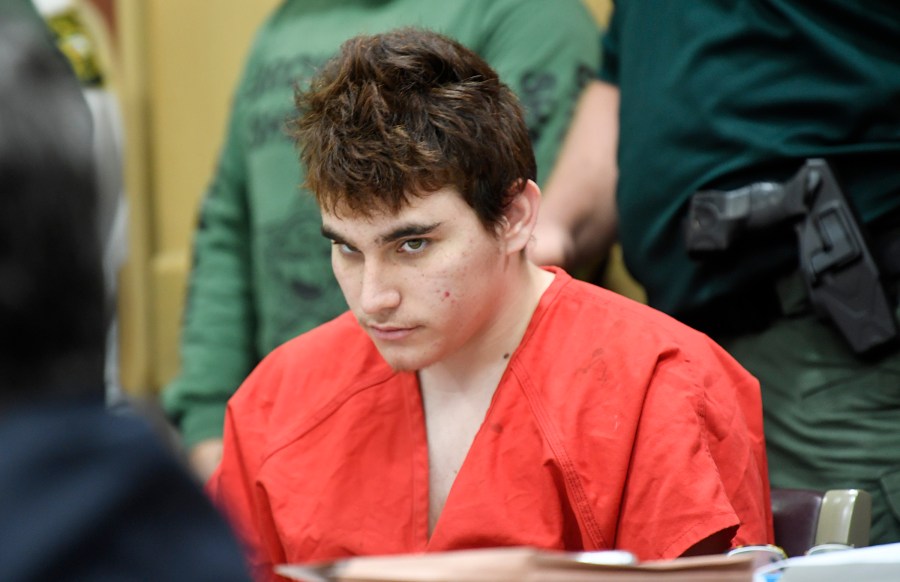 Florida school shooting suspect Nikolas Cruz quickly glances up at the prosecutors during a hearing on April 27, 2018, in Fort Lauderdale, Florida. (Taimy Alvarez-Pool/Getty Images)