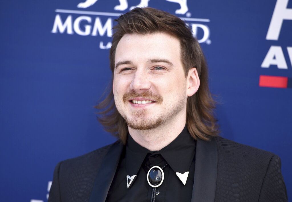 Morgan Wallen arrives at the 54th annual Academy of Country Music Awards in 2019. Wallen fans are buying up his latest album after he appeared on a video shouting a racial slur. Wallen's sophomore record, "Dangerous: The Double Album" retains its top spot for a fourth week on Billboard's all-genre albums chart.(Photo by Jordan Strauss/Invision/AP, File)