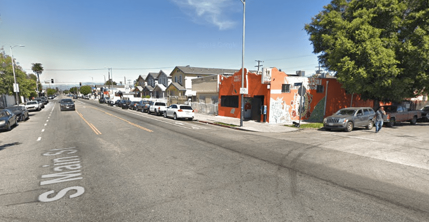 The intersection of Main and 97th Streets is shown in a Street View image from Google Maps.