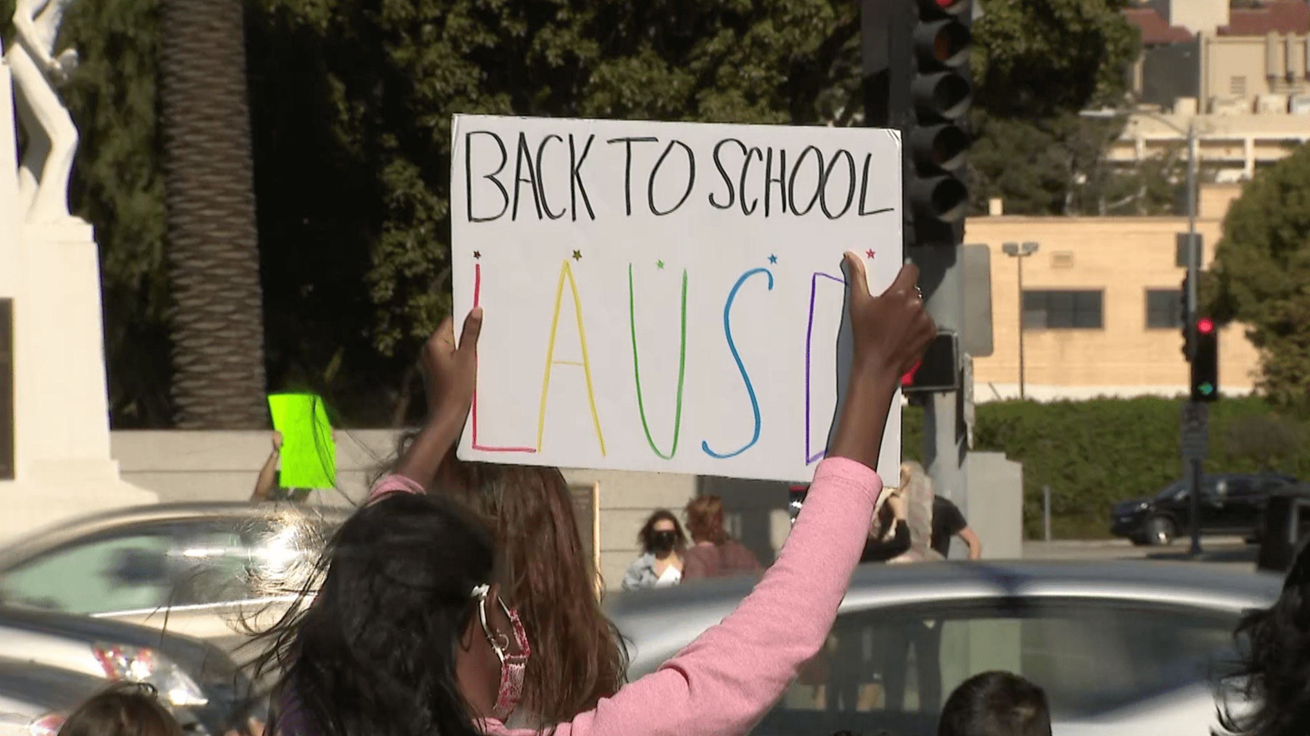 A rally to reopen schools is held in West L.A. Feb. 27, 2021.