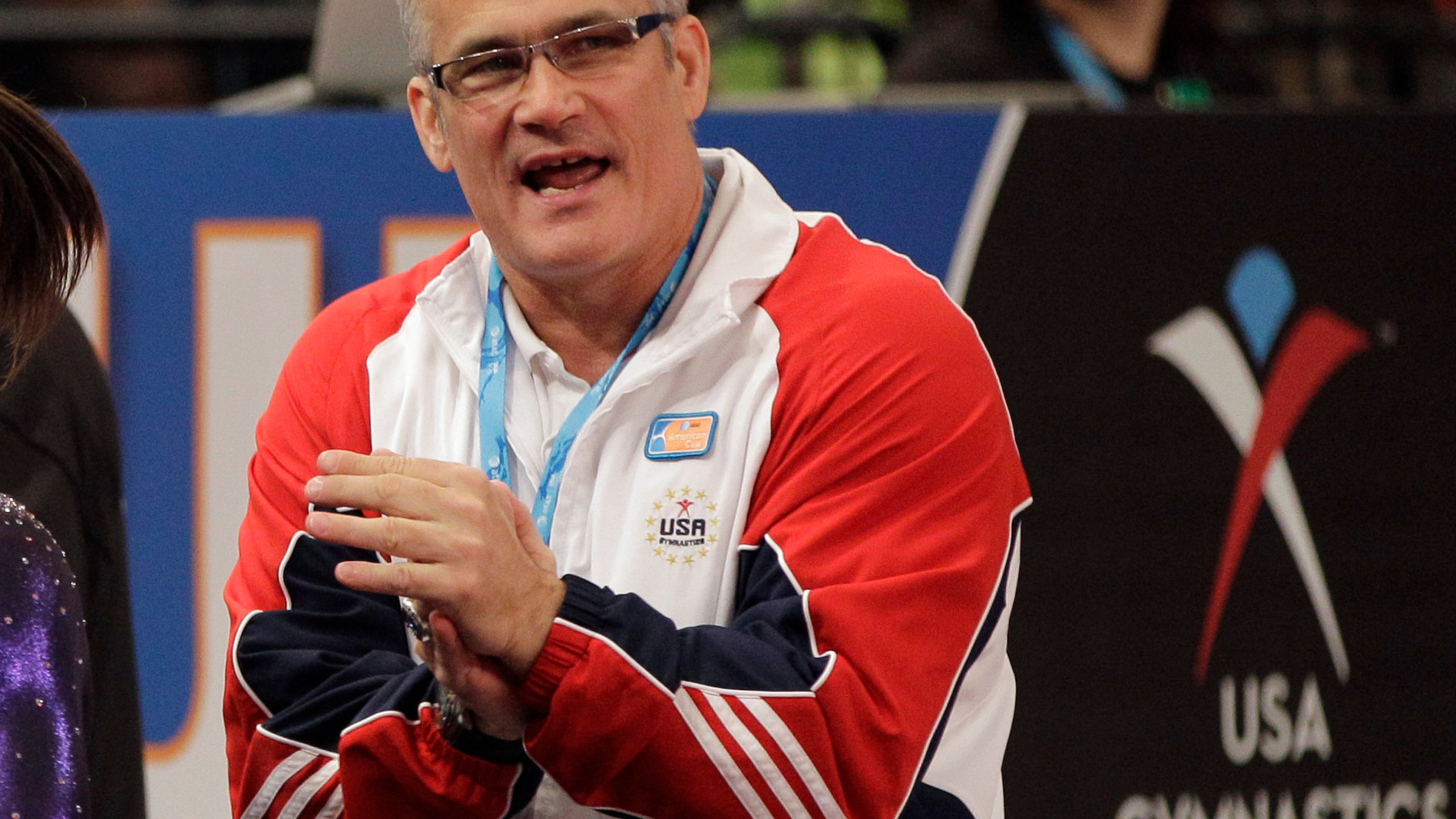 In this March 3, 2012, file photo, gymnastics coach John Geddert is seen at the American Cup gymnastics meet at Madison Square Garden in New York. Prosecutors in Michigan filed charges Thursday, Feb. 25, 2021, against Geddert, a former U.S. Olympics gymnastics coach with ties to disgraced sports doctor Larry Nassar. Geddert was head coach of the 2012 U.S. women's Olympic gymnastics team, which won a gold medal. (AP Photo/Kathy Willens, File)