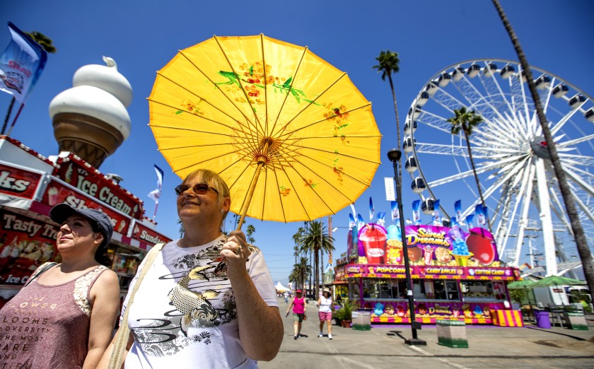 Danica Paz, left, of Sherman Oaks, and Amy Barer, of Los Angeles, attend the 2018 Los Angeles County Fair at the Fairplex in Pomona.(Allen J. Schaben / Los Angeles Times)