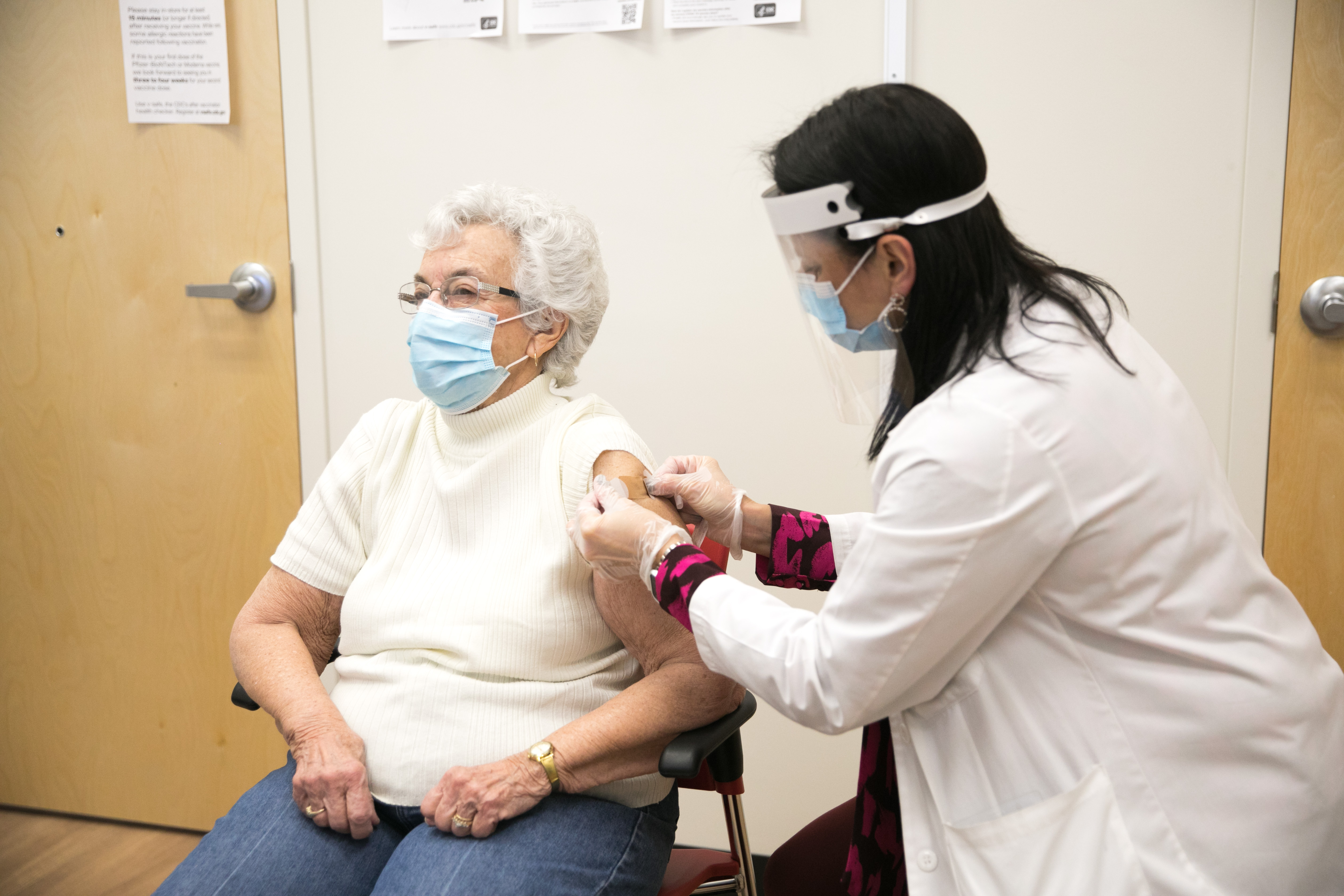 A woman gets her COVID-19 Vaccine at a CVS Pharmacy on Jan. 28, 2021, in Fall River, Mass. (Scott Eisen/CVS Health via AP Images)