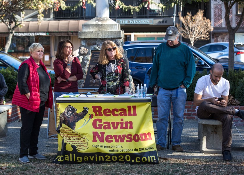 Supporters of an effort to recall Gov. Gavin Newsom collected signatures at a Make America Great Again rally in December 2020 in Solvang. (George Rose / Getty Images)