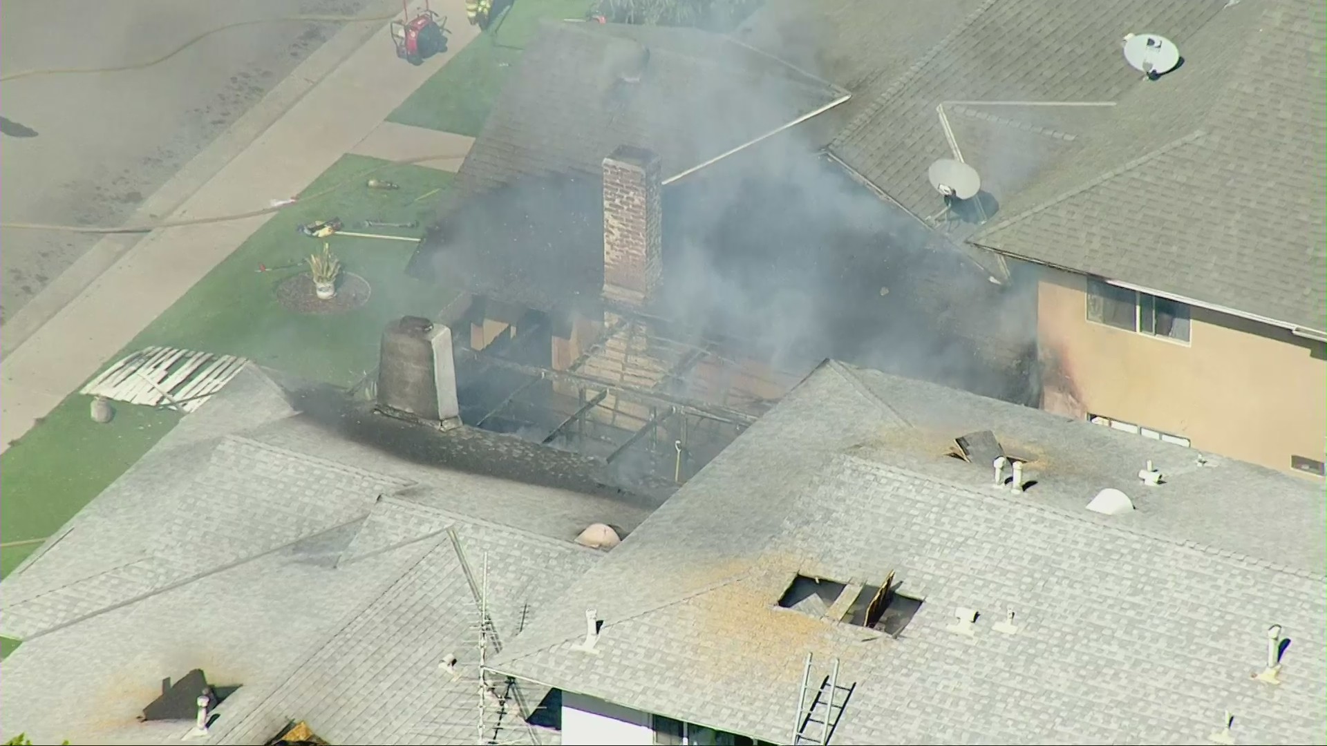 Firefighters battled a house fire in Fountain Valley on Feb. 18, 2021. (KTLA)