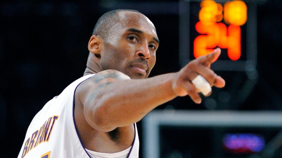 In this June 7, 2009, file photo, Los Angeles Lakers guard Kobe Bryant points to a player behind him after making a basket in the closing seconds against the Orlando Magic in Game 2 of the NBA basketball finals in Los Angeles.