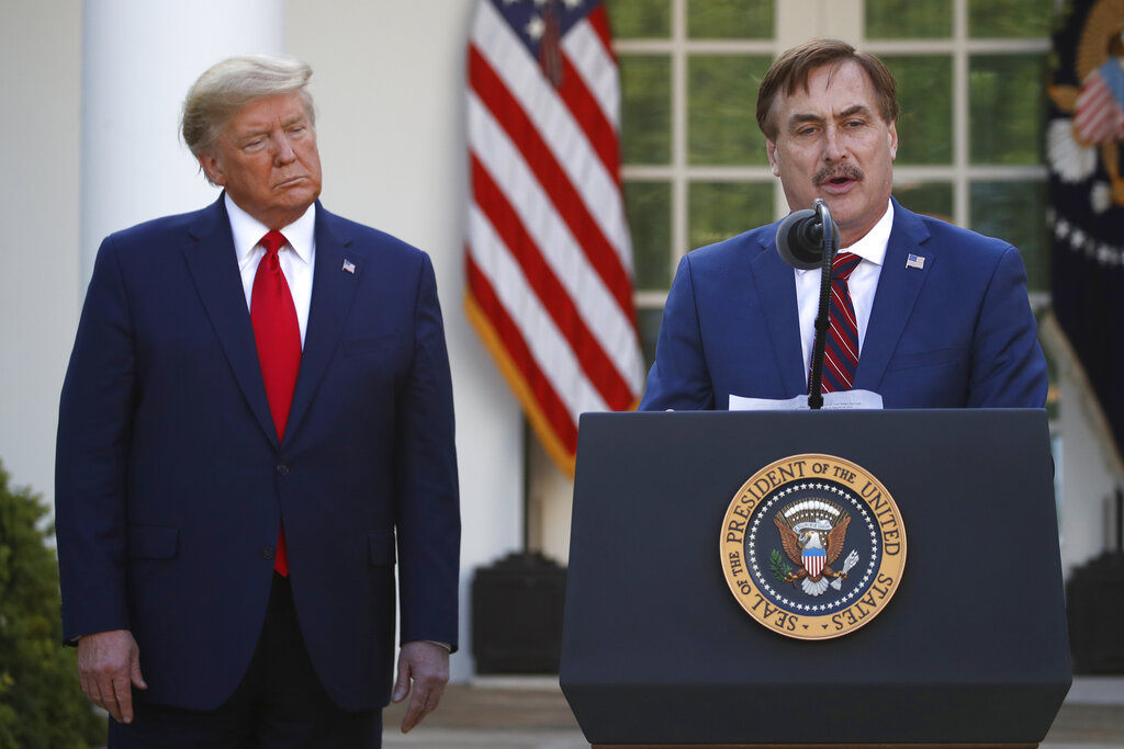 My Pillow CEO Mike Lindell speaks as President Donald Trump listens during a briefing about the coronavirus in the Rose Garden in March 2020. (AP Photo/Alex Brandon, File)