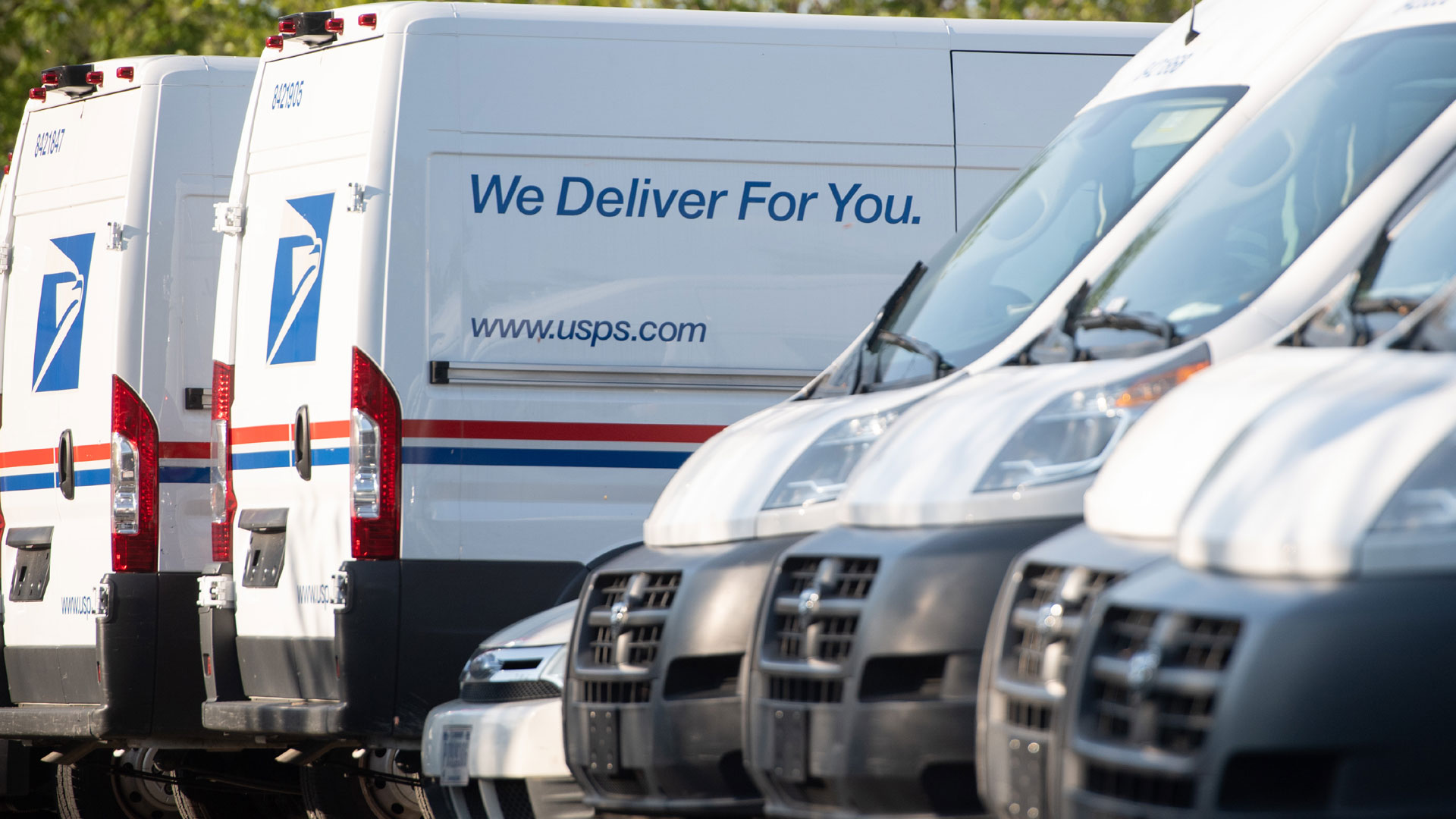 Postal trucks are parked at a U.S. Postal Service post office location in this undated file photo. (Saul Loeb /AFP / Getty Images)