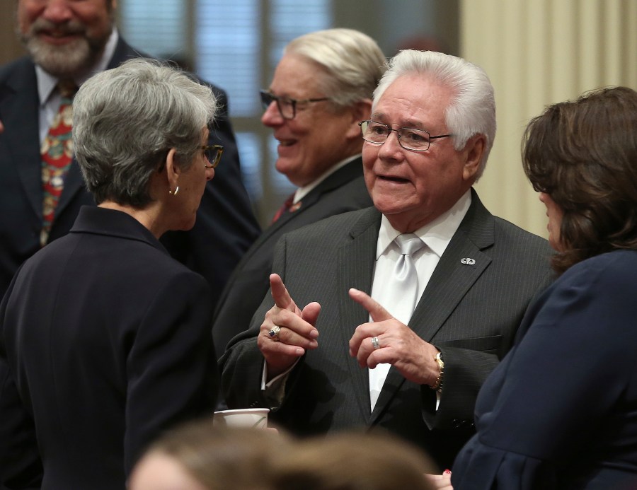 Freshman state Sen. Bob Archuleta, D-Pico Rivera, talks with Sen. Hannah-Beth Jackson, D-Santa Barbara, left, during the state Senate session on Dec. 3, 2018 in Sacramento. (Rich Pedroncelli/Associated Press)