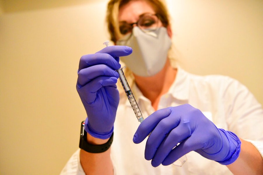 This September 2020, file photo provided by Johnson & Johnson shows a pharmacist preparing to give an experimental COVID-19 vaccine. (Johnson & Johnson via AP, File)