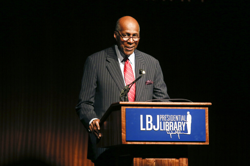 In this April 9, 2014 file photo, civil rights activist Vernon Jordan introduces former President Bill Clinton during the Civil Rights Summit in Austin, Texas. (AP Photo/Jack Plunkett, File)