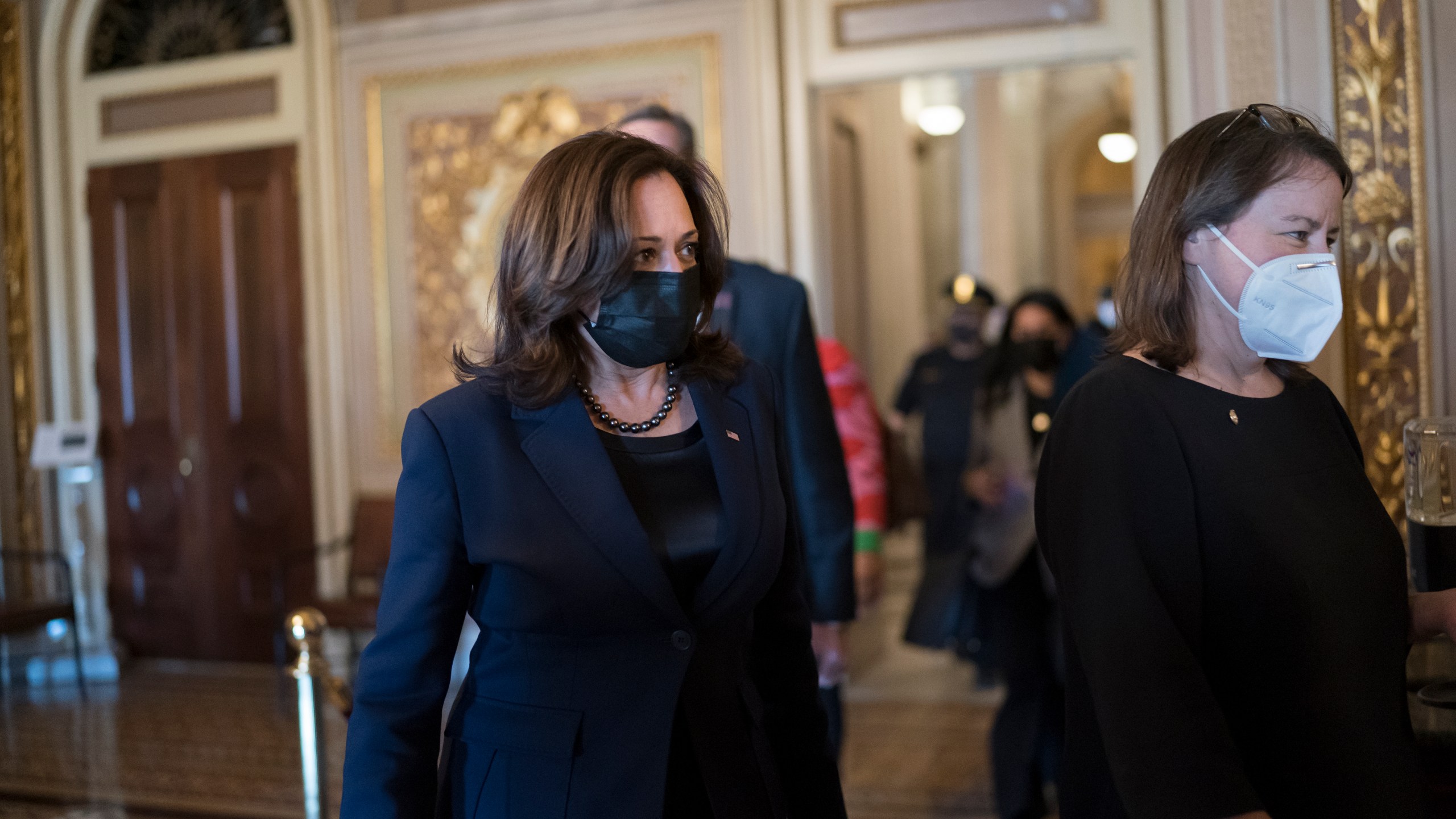 Vice President Kamala Harris arrives to break the tie on a procedural vote as the Senate works on the Democrats' $1.9 trillion COVID relief package, on Capitol Hill in Washington, Thursday, March 4, 2021. (AP Photo/J. Scott Applewhite)