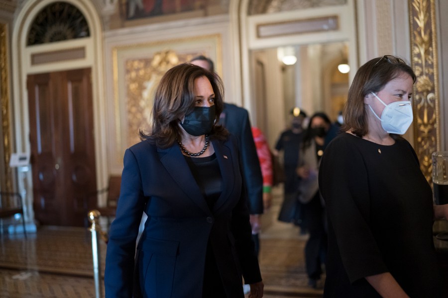 Vice President Kamala Harris arrives to break the tie on a procedural vote as the Senate works on the Democrats' $1.9 trillion COVID relief package, on Capitol Hill in Washington, Thursday, March 4, 2021. (AP Photo/J. Scott Applewhite)