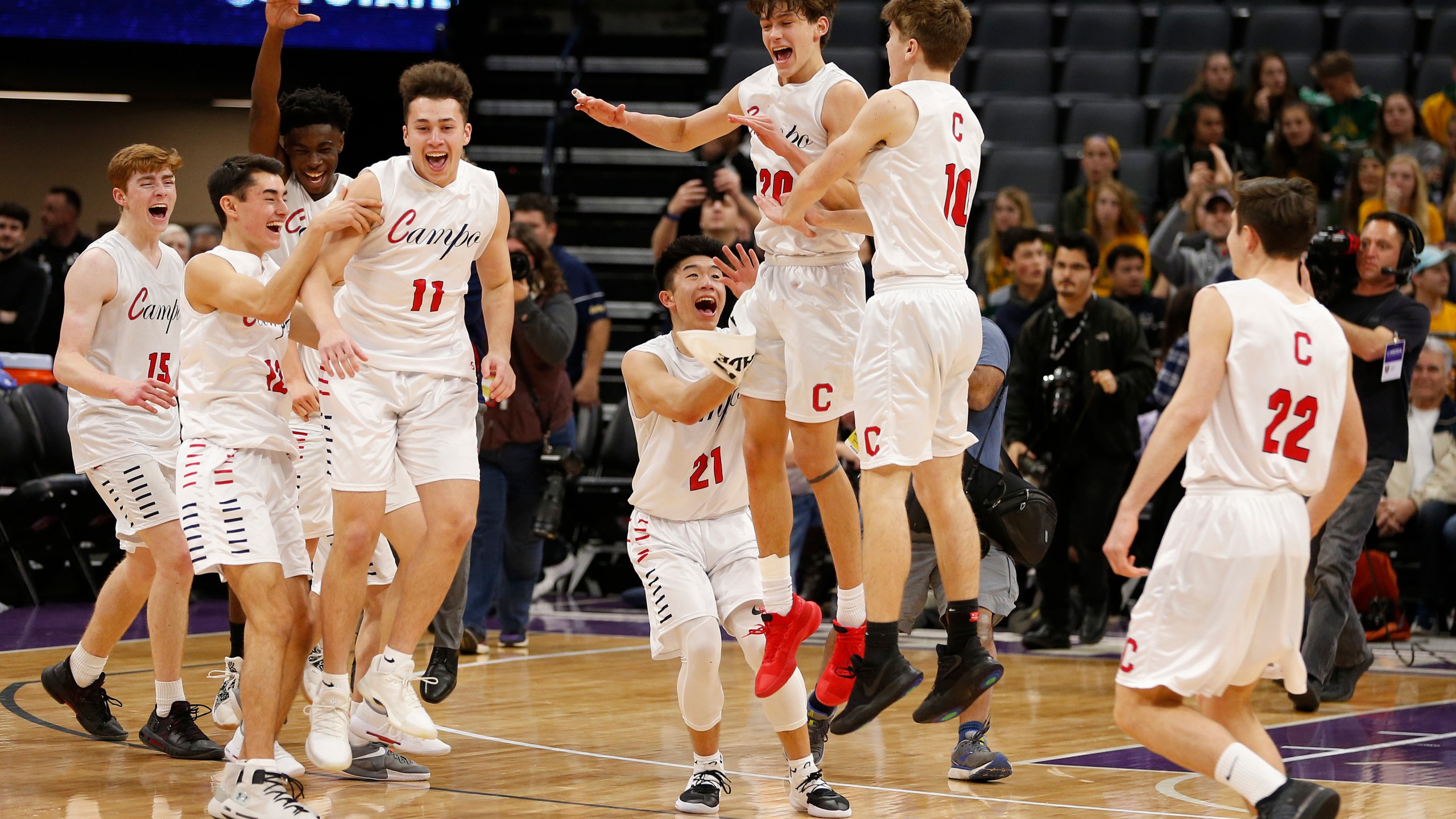 Campolindo players celebrate a win over Colony in the CIF boys' Division II state high school basketball championship game in Sacramento on March 9, 2019. (Rich Pedroncelli / Associated Press)