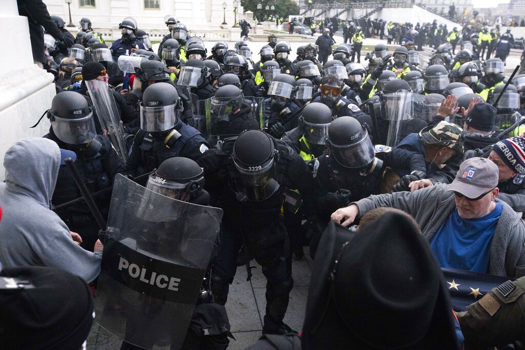 In this Jan. 6, 2021, file photo, U.S. Capitol Police push back rioters trying to enter the U.S. Capitol in Washington. (AP Photo/Jose Luis Magana, File)