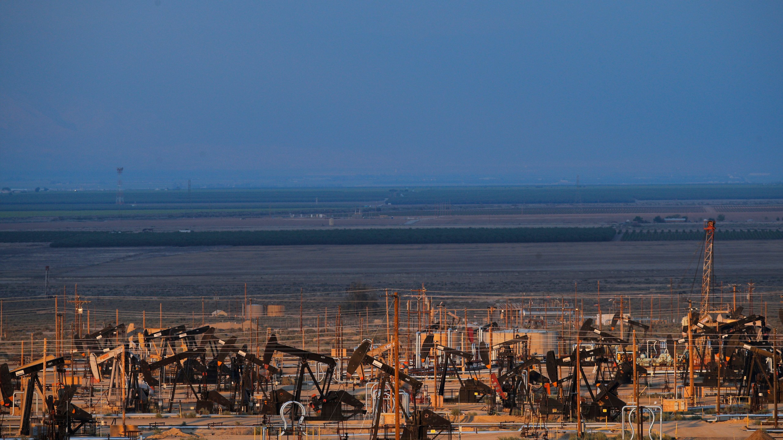 Oil pump jacks are seen in an oil field near Taft, Calif., on May 1, 2018. (Jae C. Hong / Associated Press)