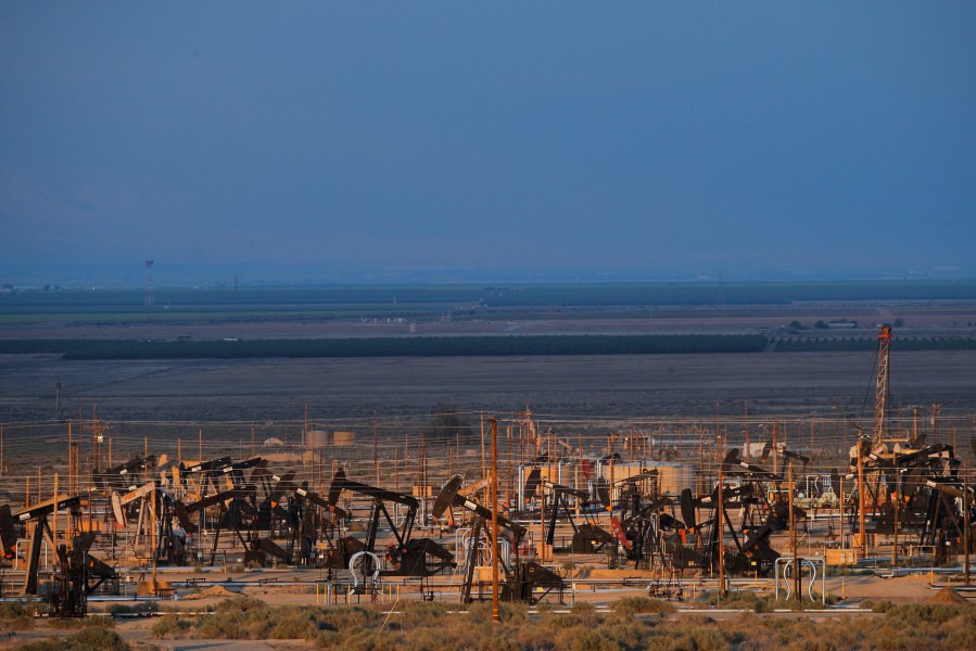 Oil pump jacks are seen in an oil field near Taft, Calif., on May 1, 2018. (Jae C. Hong / Associated Press)