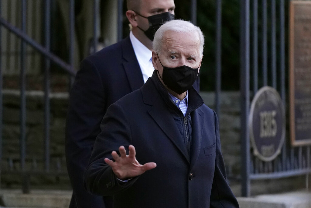 President Joe Biden departs after attending Mass at Holy Trinity Catholic Church in the Georgetown neighborhood of Washington, Saturday, March 6, 2021. (AP Photo/Patrick Semansky)