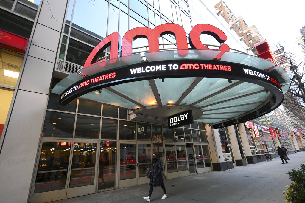 A pedestrian walks by the newly reopened AMC 34th Street theater on March 5, 2021, in New York. (Evan Agostini/Invision/AP)