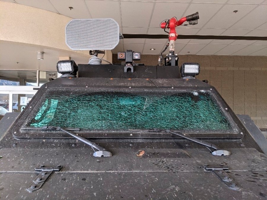 This Sunday, March 7, 2021, photo released by the City of Boulder shows the smashed windshield of a Terradyne light armored patrol vehicle at the Boulder Police Department in Boulder, Colo. (Boulder Police Department/ City of Boulder via AP)