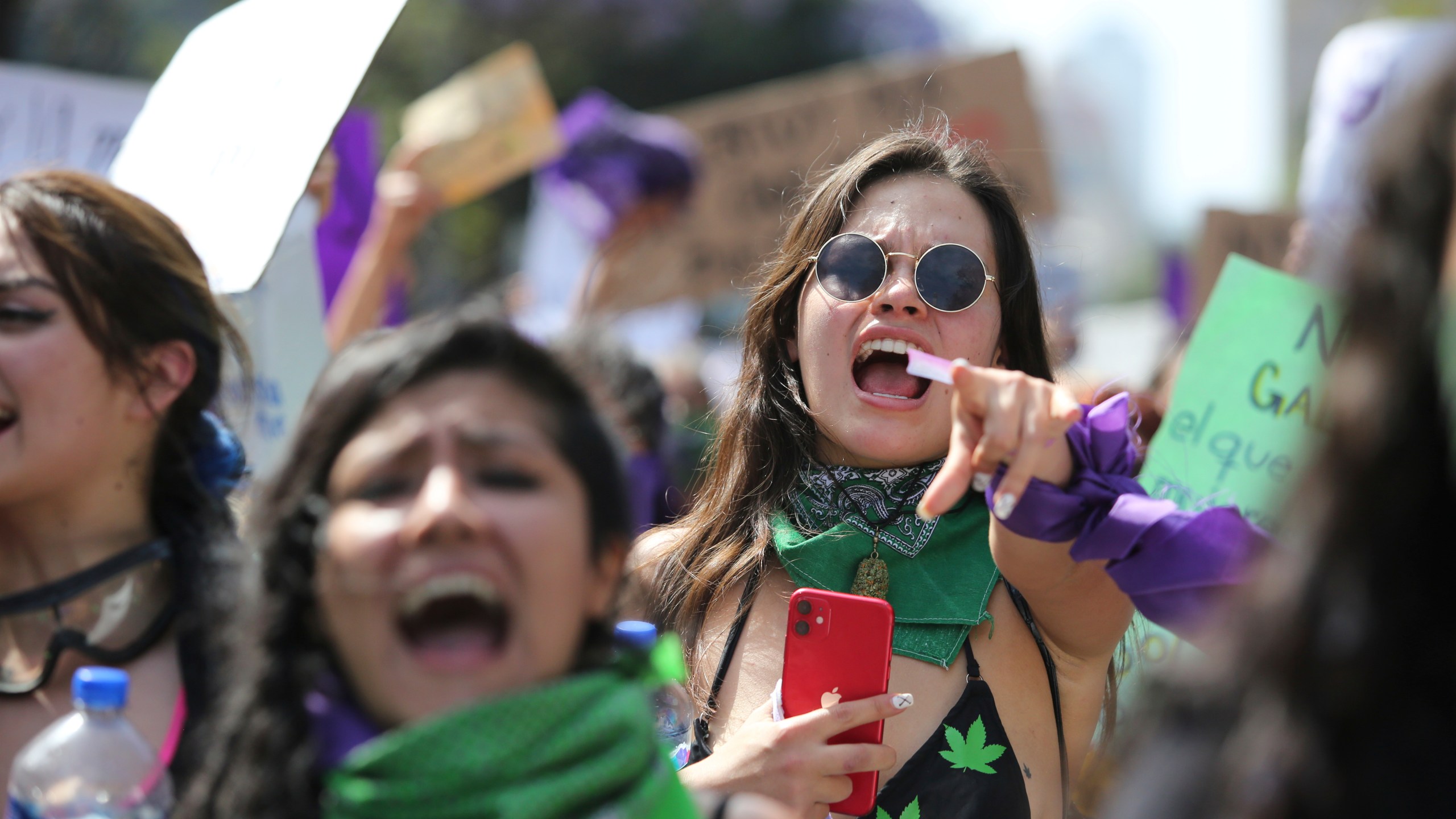 Women protest during a march to commemorate International Women's Day and protest against gender violence, in Mexico City, Monday, March 8, 2021. (AP Photo/Ginnette Riquelme)