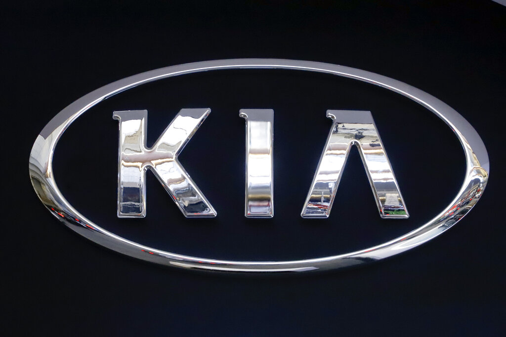 In this Feb. 14, 2019 file photo, the KIA logo is displayed on a sign at the 2019 Pittsburgh International Auto Show in Pittsburgh. (AP Photo/Gene J. Puskar, File)