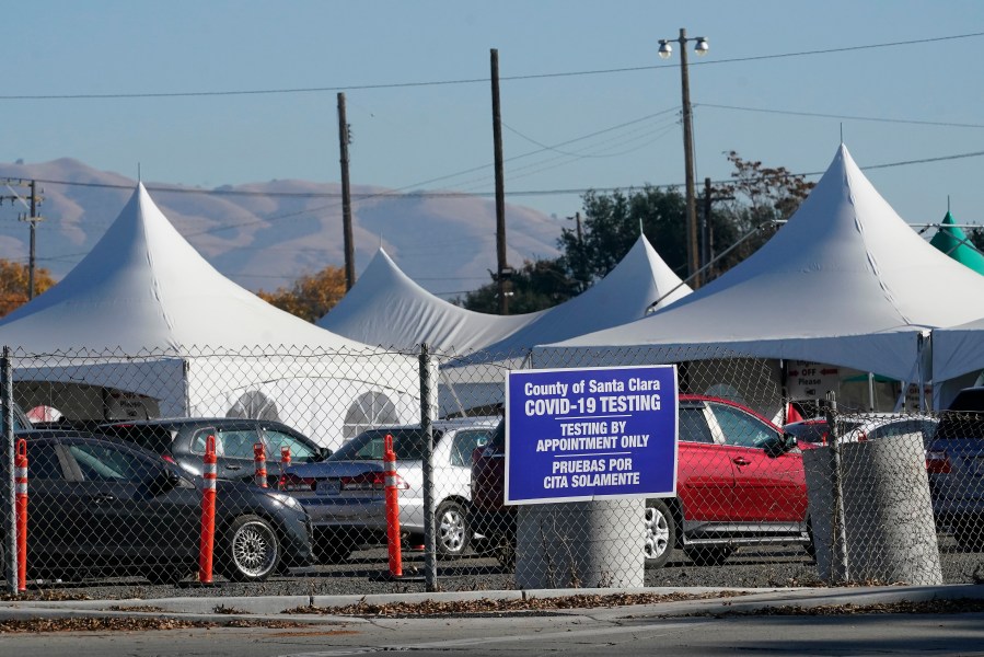 Cars line up at a Santa Clara County COVID-19 testing site in San Jose during the coronavirus pandemic on Dec. 1, 2020. (Jeff Chiu / Associated Press)