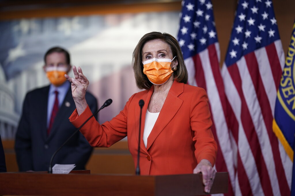 Speaker of the House Nancy Pelosi, D-Calif., holds a news conference on passage of gun violence prevention legislation, at the Capitol in Washington, Thursday, March 11, 2021, as Sen. Richard Blumenthal, D-Conn., looks on. (AP Photo/J. Scott Applewhite)