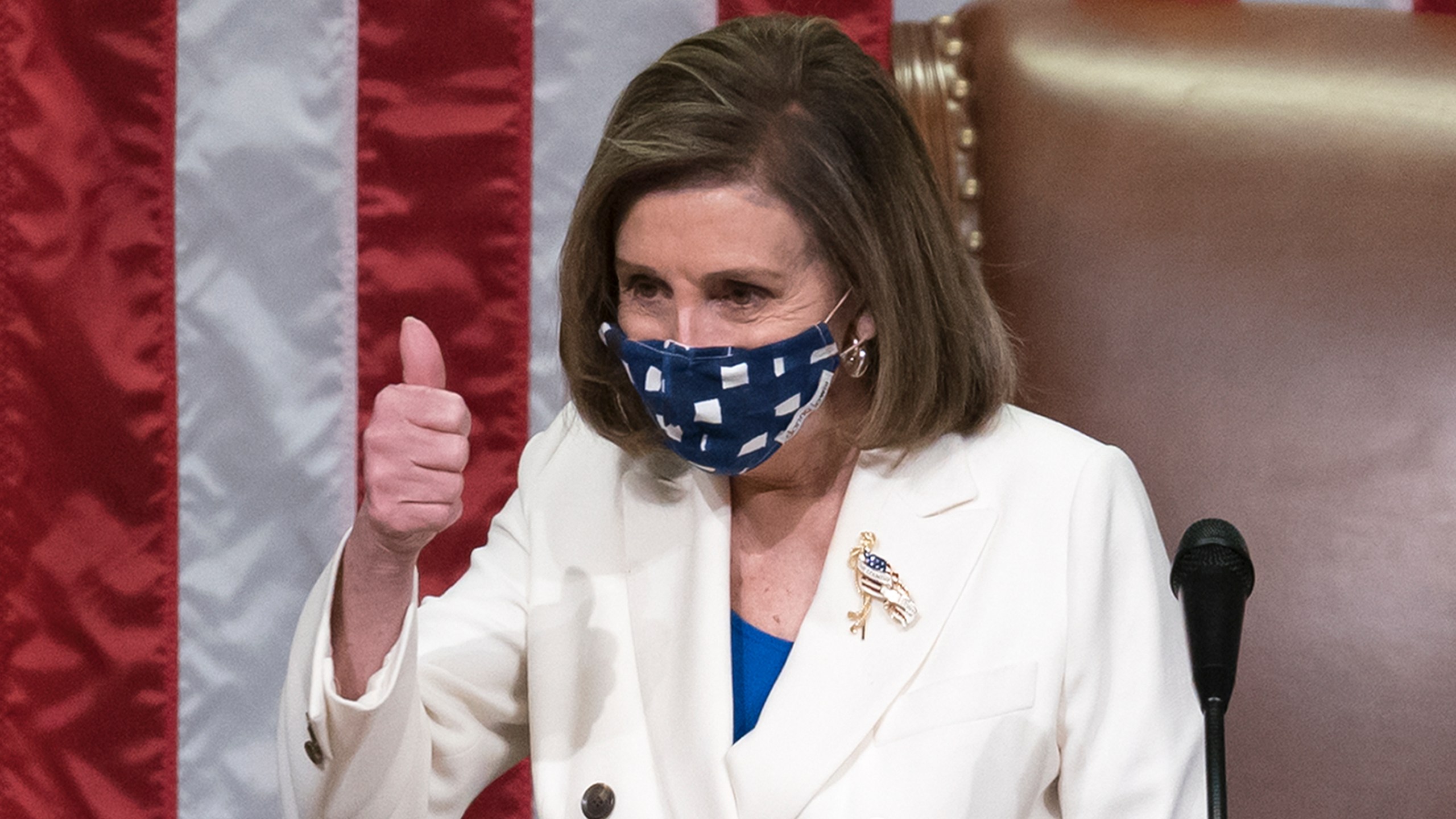 Speaker of the House Nancy Pelosi, D-Calif., gestures after the $1.9 trillion COVID-19 relief bill was passed at the Capitol in Washington on March 10, 2021. (J. Scott Applewhite / Associated Press)