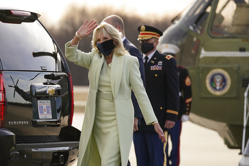 First lady Jill Biden waves as she walks to a motorcade vehicle after stepping off Marine One at Delaware Air National Guard Base in New Castle, Del., Friday, March 12, 2021. (AP Photo/Patrick Semansky)