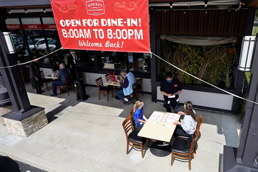 Diners Evie Costello, left, and Mandissa Costello, right, are served by Isaac Villaneva at Agoura's Famous Deli Sunday, March 14, 2021, in the Agoura Hills section of Los Angeles County. (AP Photo/Mark J. Terrill)Diners Evie Costello, left, and Mandissa Costello, right, are served by Isaac Villaneva at Agoura's Famous Deli Sunday, March 14, 2021, in the Agoura Hills section of Los Angeles County. (AP Photo/Mark J. Terrill)