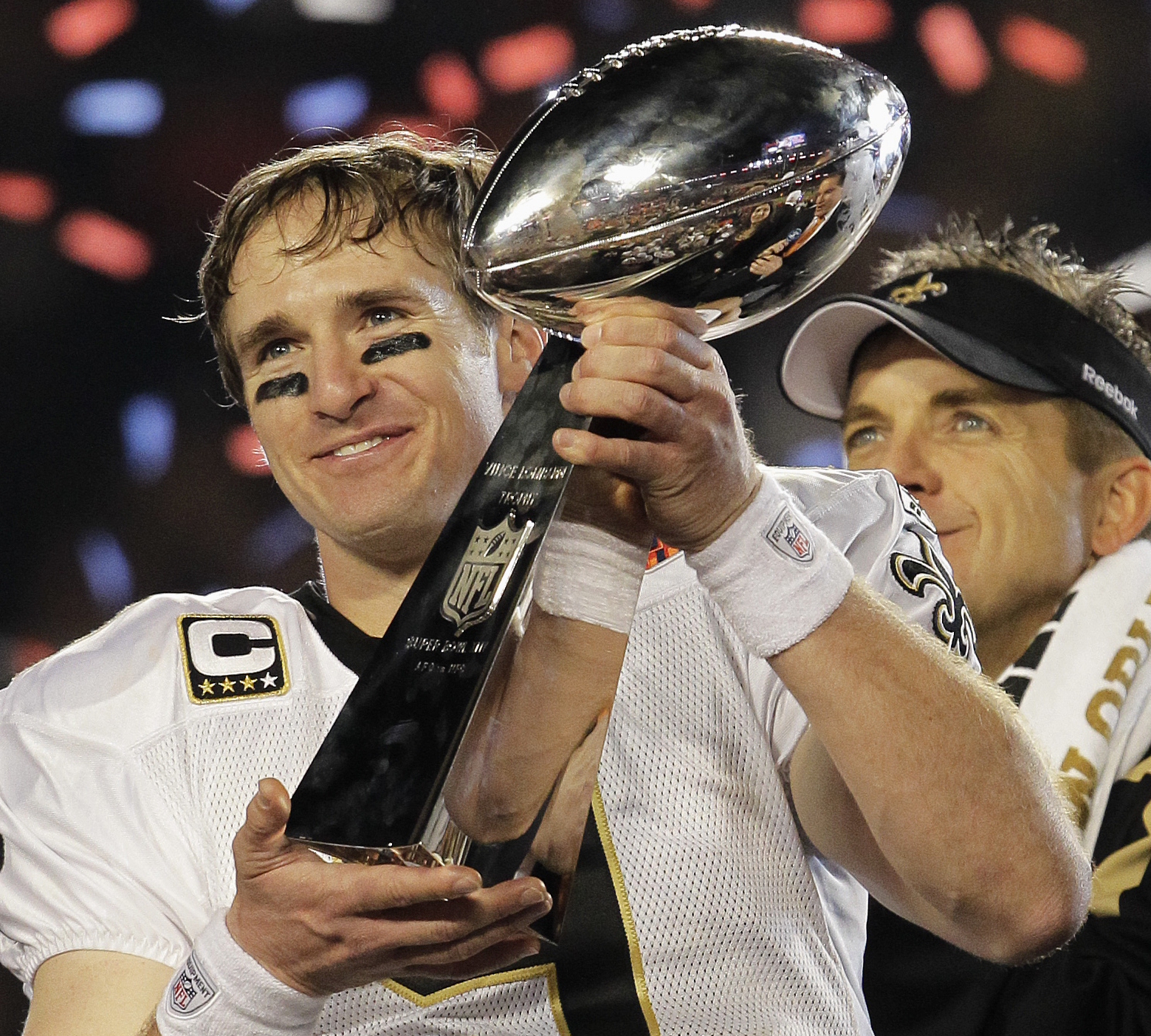 This Feb. 7, 2010, file photo shows New Orleans Saints quarterback Drew Brees (9) celebrating with the Vince Lombardi Trophy after the Saints' 31-17 win over the Indianapolis Colts in the NFL Super Bowl XLIV football game in Miami. (AP Photo/Julie Jacobson, File)