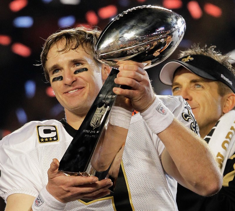 This Feb. 7, 2010, file photo shows New Orleans Saints quarterback Drew Brees (9) celebrating with the Vince Lombardi Trophy after the Saints' 31-17 win over the Indianapolis Colts in the NFL Super Bowl XLIV football game in Miami. (AP Photo/Julie Jacobson, File)