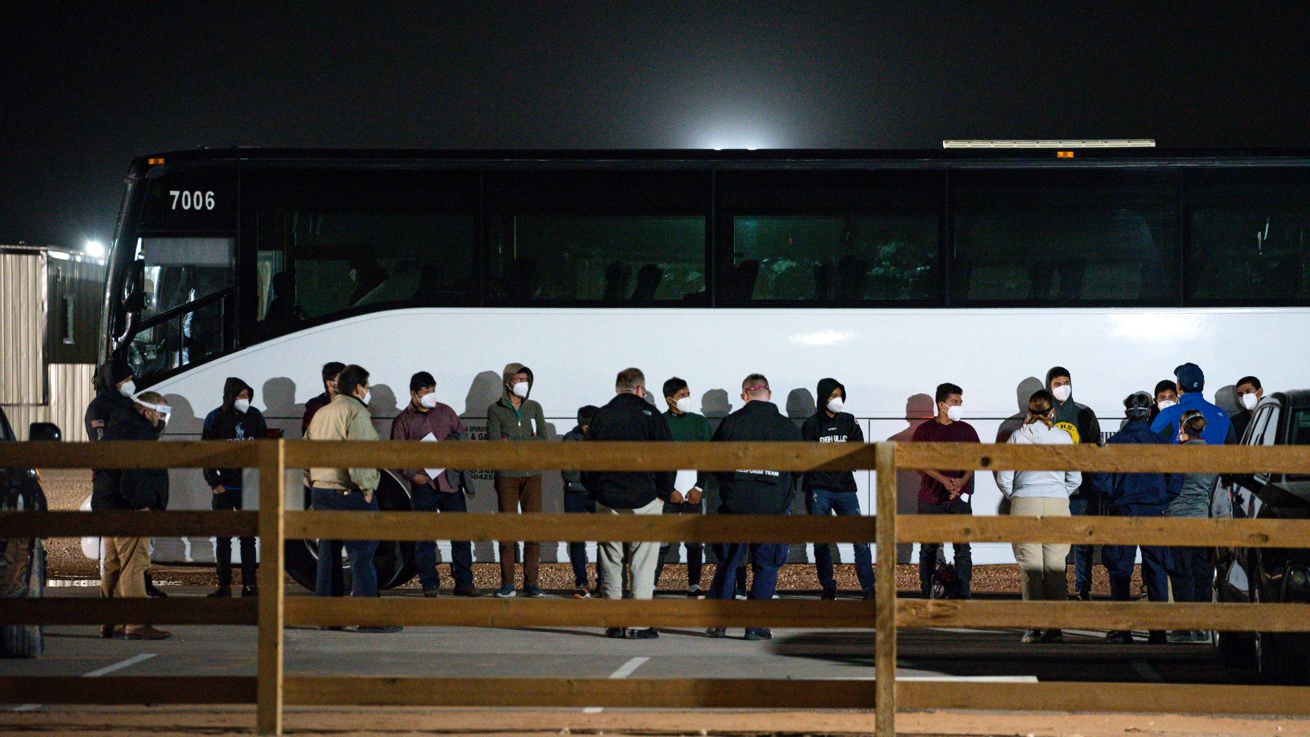 In this Sunday, March 14, 2021, file photo, migrant children and teenagers are processed after entering the site of a temporary holding facility south of Midland, Texas. Teenagers began arriving Sunday at a converted camp for oilfield workers where volunteers from the American Red Cross will care for them. (Eli Hartman/Odessa American via AP, File)