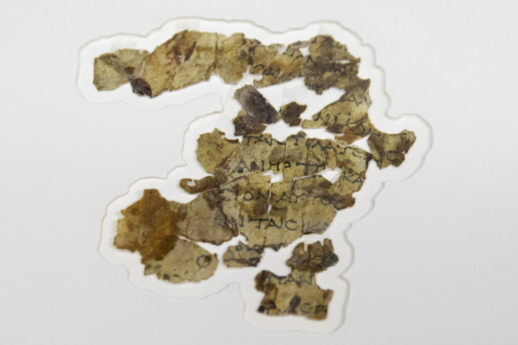 The Israel Antiquities Authority displays newly discovered Dead Sea Scroll fragments at the Dead Sea scrolls conservation lab in Jerusalem, Tuesday, March 16, 2021. (AP Photo/Sebastian Scheiner)