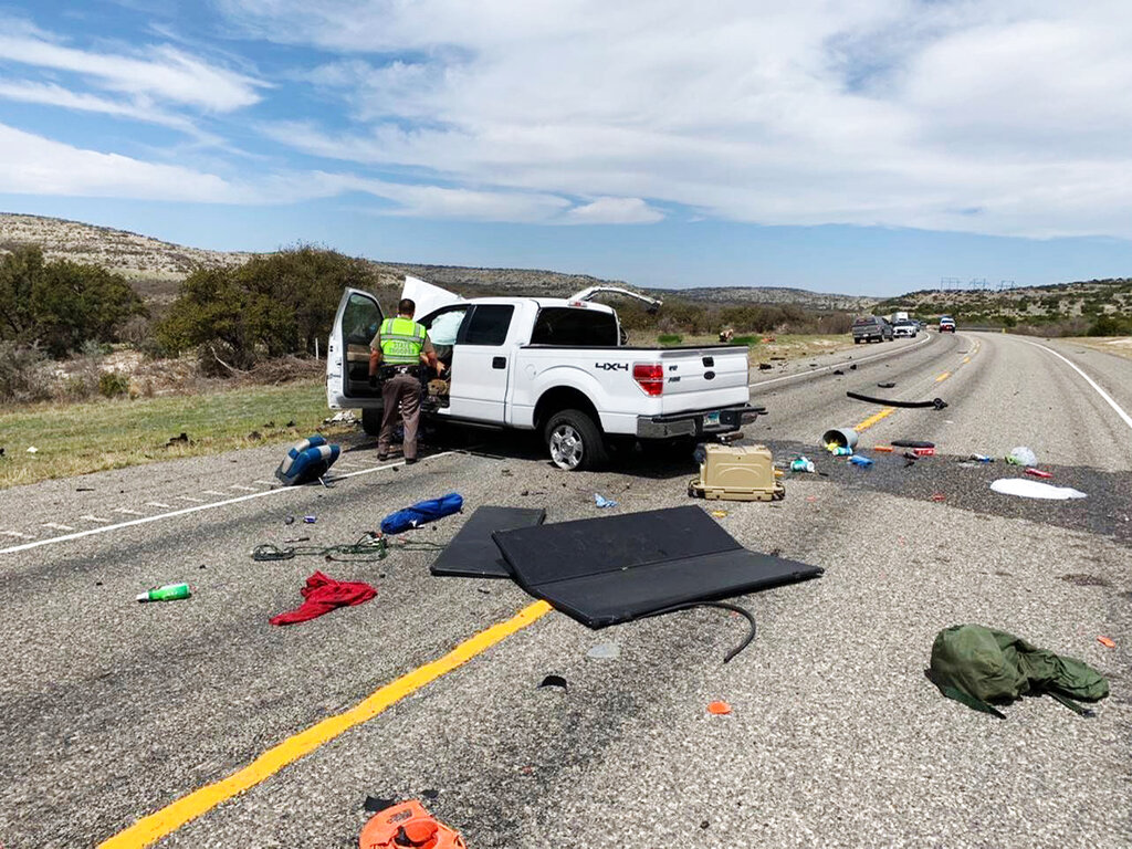 Debris is strewn across a road near the border city of Del Rio, Texas after a collision Monday, March 15, 2021. (Texas Department of Public Safety via AP)