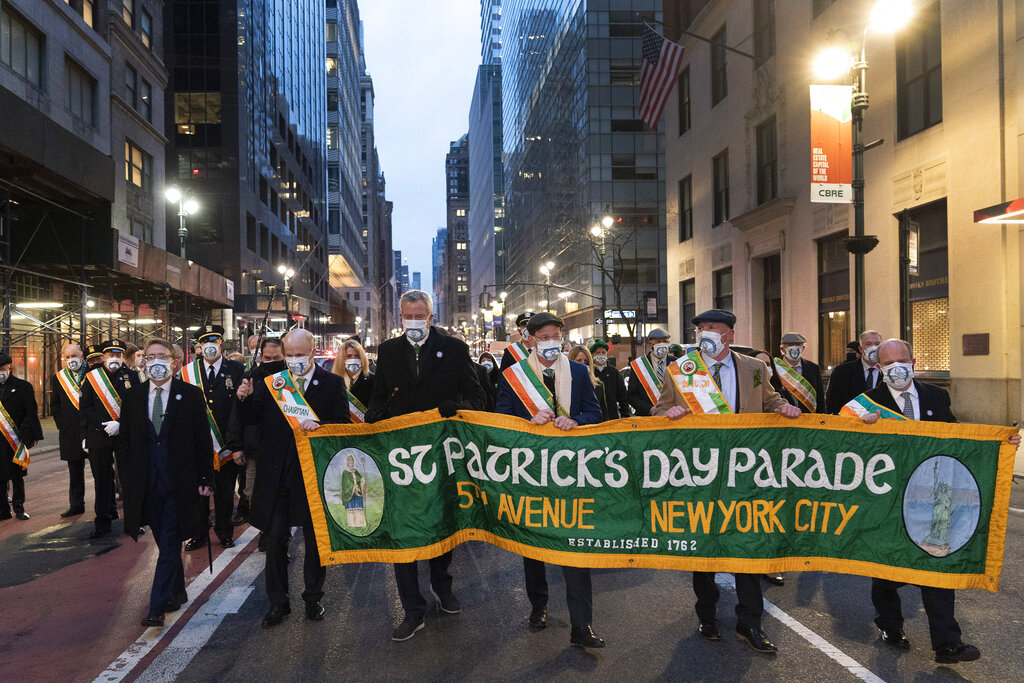 Mayor Bill de Blasio, center, marches during the St. Patrick's Day Parade early Wednesday, March 17, 2021 in New York. (AP Photo/Mark Lennihan)