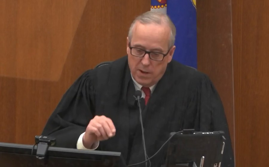 In this screen grab from video, Hennepin County Judge Peter Cahill presides over jury selection, Wednesday, March 17, 2021, in the trial of former Minneapolis police officer Derek Chauvin, in the May 25, 2020, death of George Floyd at the Hennepin County Courthouse in Minneapolis, Minn. The Judge dismissed a juror seated for ex-officer's trial who said $27M settlement to Floyd family would skew judgment. (Court TV, via AP, Pool)