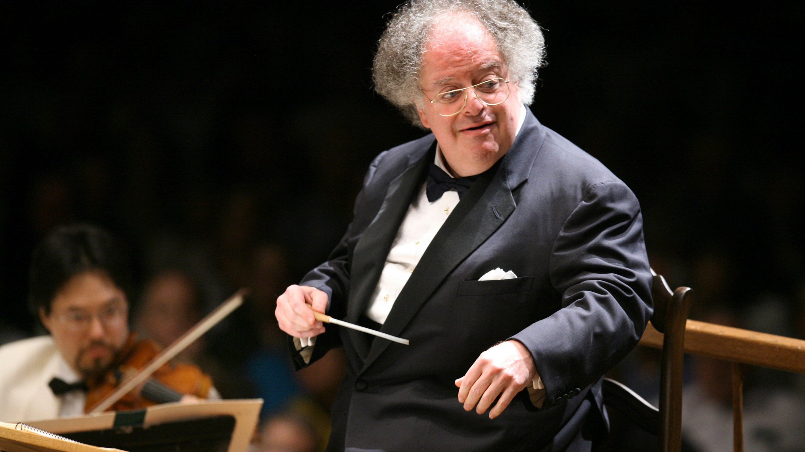 Boston Symphony Orchestra music director James Levine conducts the symphony on its opening night performance at Tanglewood in Lenox, Mass. on July 7, 2006. Levine, who ruled over the Metropolitan Opera for 4 1/2 decades before being eased out when his health declined and then fired for sexual improprieties, died March 9, 2021 in Palm Springs. (Michael Dwyer/Associated Press)