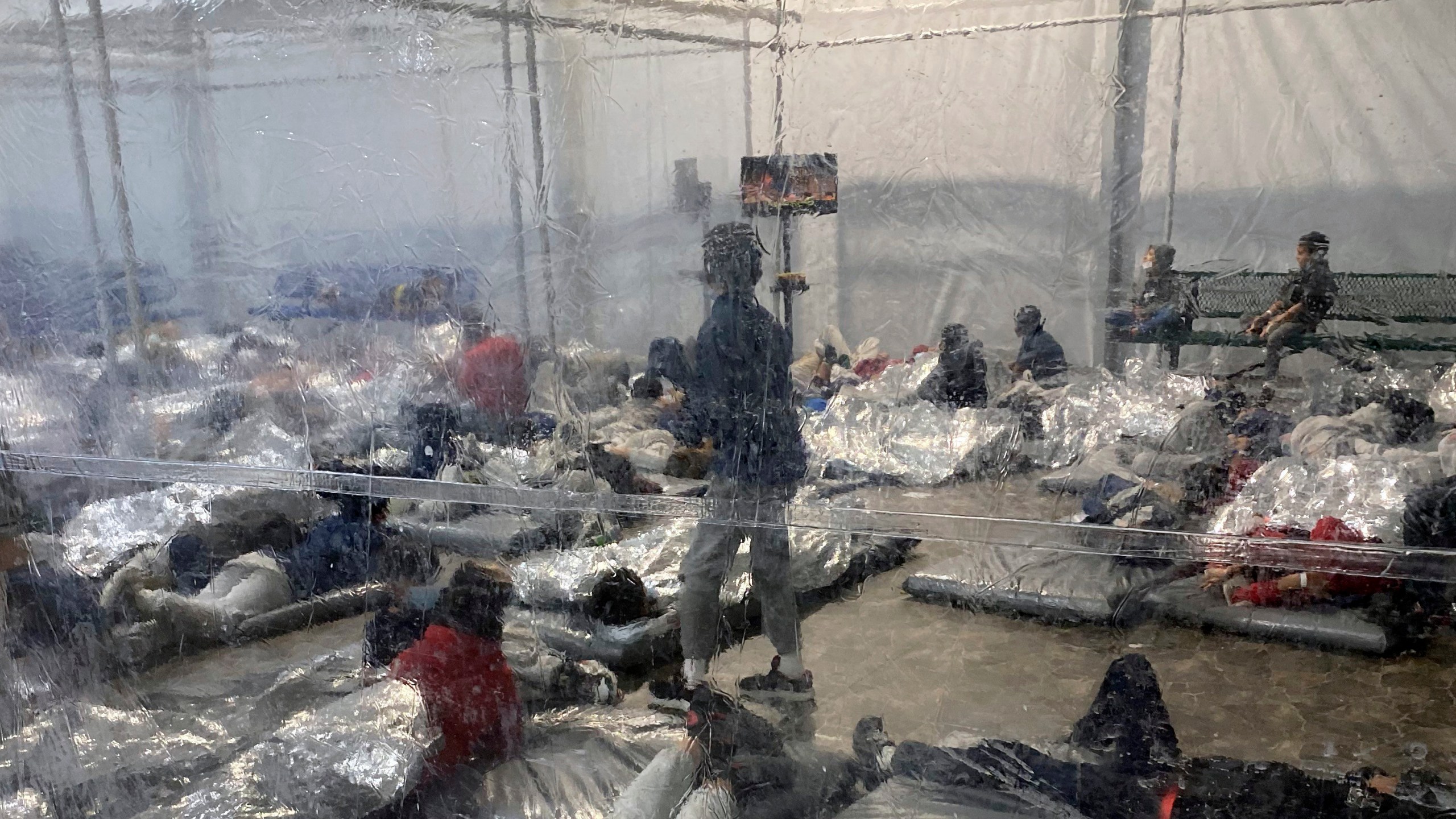 This March 20, 2021, photo provided by the Office of Rep. Henry Cuellar, D-Texas, shows detainees in a Customs and Border Protection (CBP) temporary overflow facility in Donna, Texas. President Joe Biden's administration faces mounting criticism for refusing to allow outside observers into facilities where it is detaining thousands of immigrant children. (Photo courtesy of the Office of Rep. Henry Cuellar via AP)