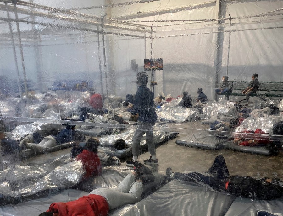 This March 20, 2021, photo provided by the Office of Rep. Henry Cuellar, D-Texas, shows detainees in a Customs and Border Protection (CBP) temporary overflow facility in Donna, Texas. President Joe Biden's administration faces mounting criticism for refusing to allow outside observers into facilities where it is detaining thousands of immigrant children. (Photo courtesy of the Office of Rep. Henry Cuellar via AP)