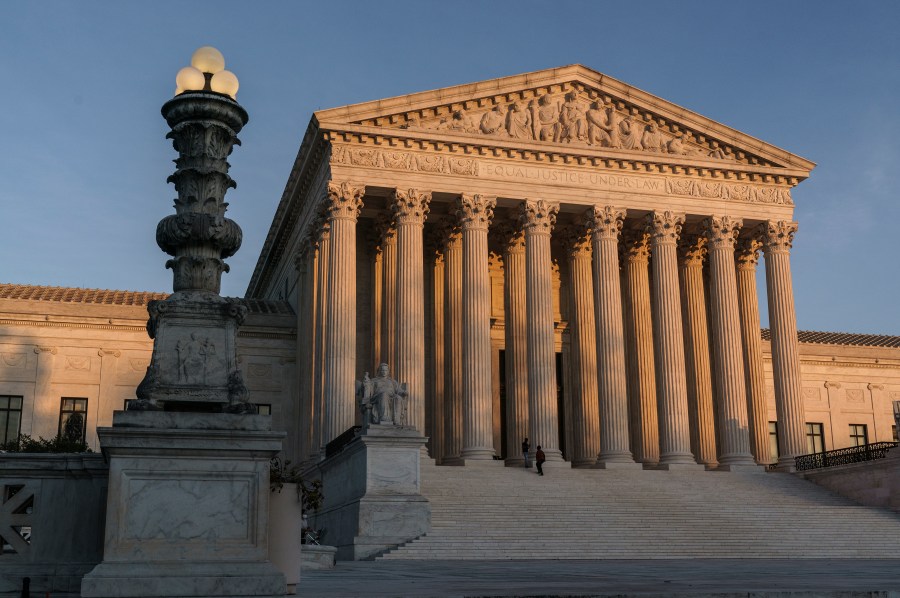 In this Nov. 6, 2020, file photo, the Supreme Court is seen at sundown in Washington. The Supreme Court appears ready to side with two California agriculture businesses that want to bar labor organizers from their property. (AP Photo/J. Scott Applewhite, File)