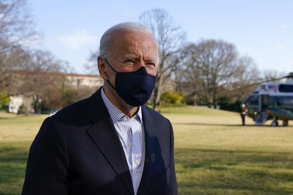 In this March 21, 2021, photo, President Joe Biden speaks with members of the press on the South Lawn of the White House in Washington. (AP Photo/Patrick Semansky)