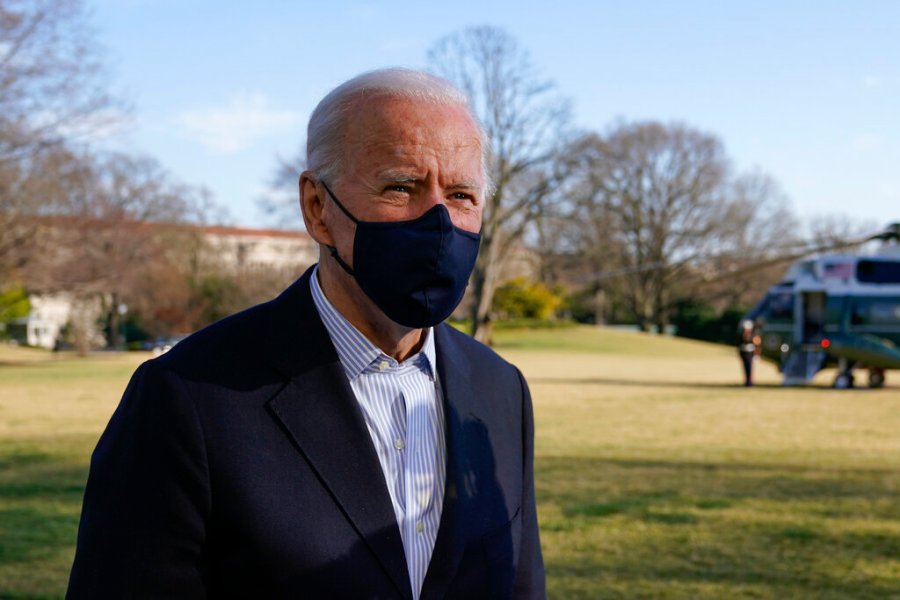 In this March 21, 2021, photo, President Joe Biden speaks with members of the press on the South Lawn of the White House in Washington. (AP Photo/Patrick Semansky)