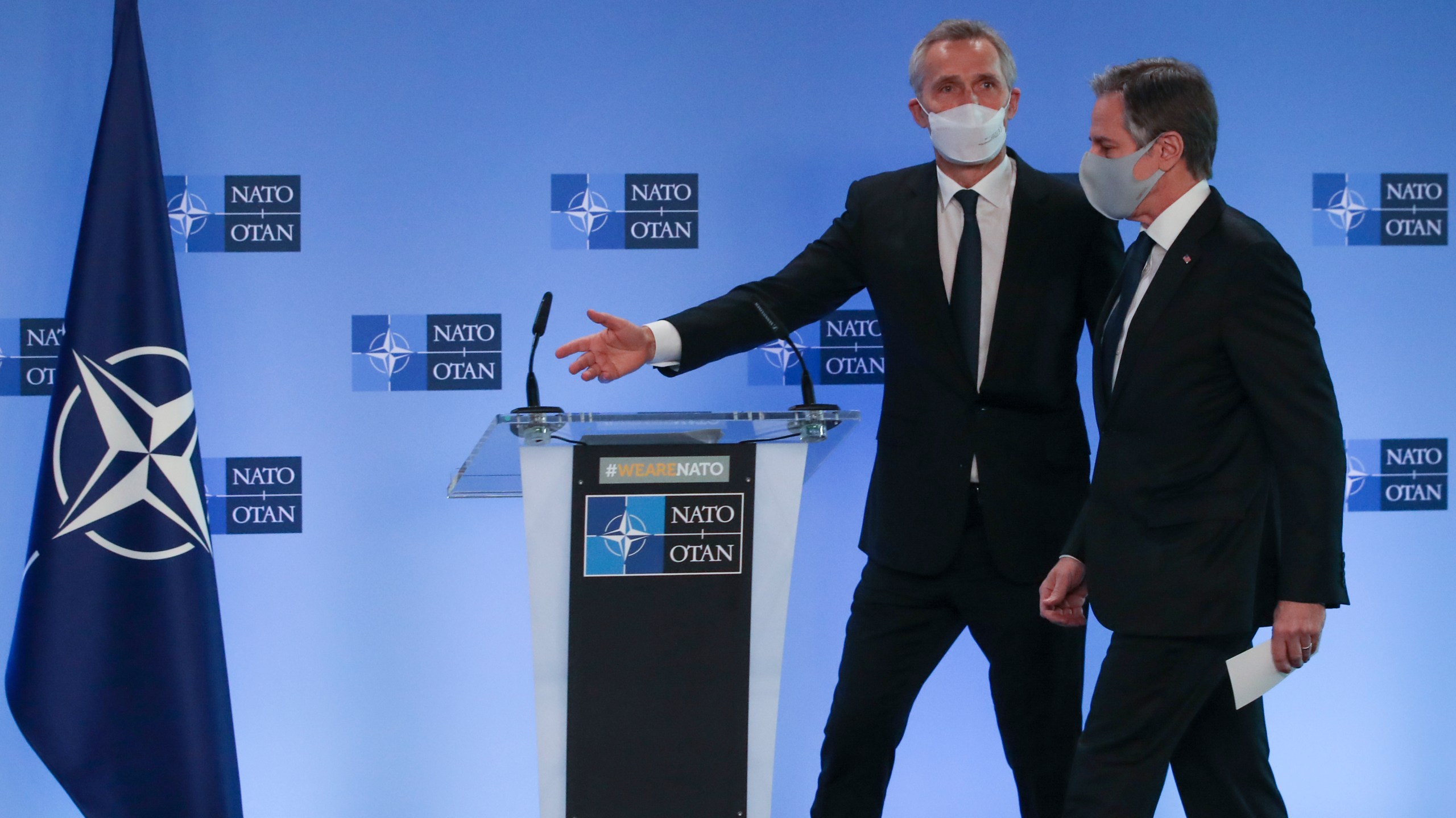 U.S. Secretary of State Antony Blinken, right, and NATO Secretary General Jens Stoltenberg arrive to give remarks prior to a NATO foreign ministers meeting at NATO headquarters in Brussels, Tuesday, March 23, 2021. (Yves Herman, Pool via AP)