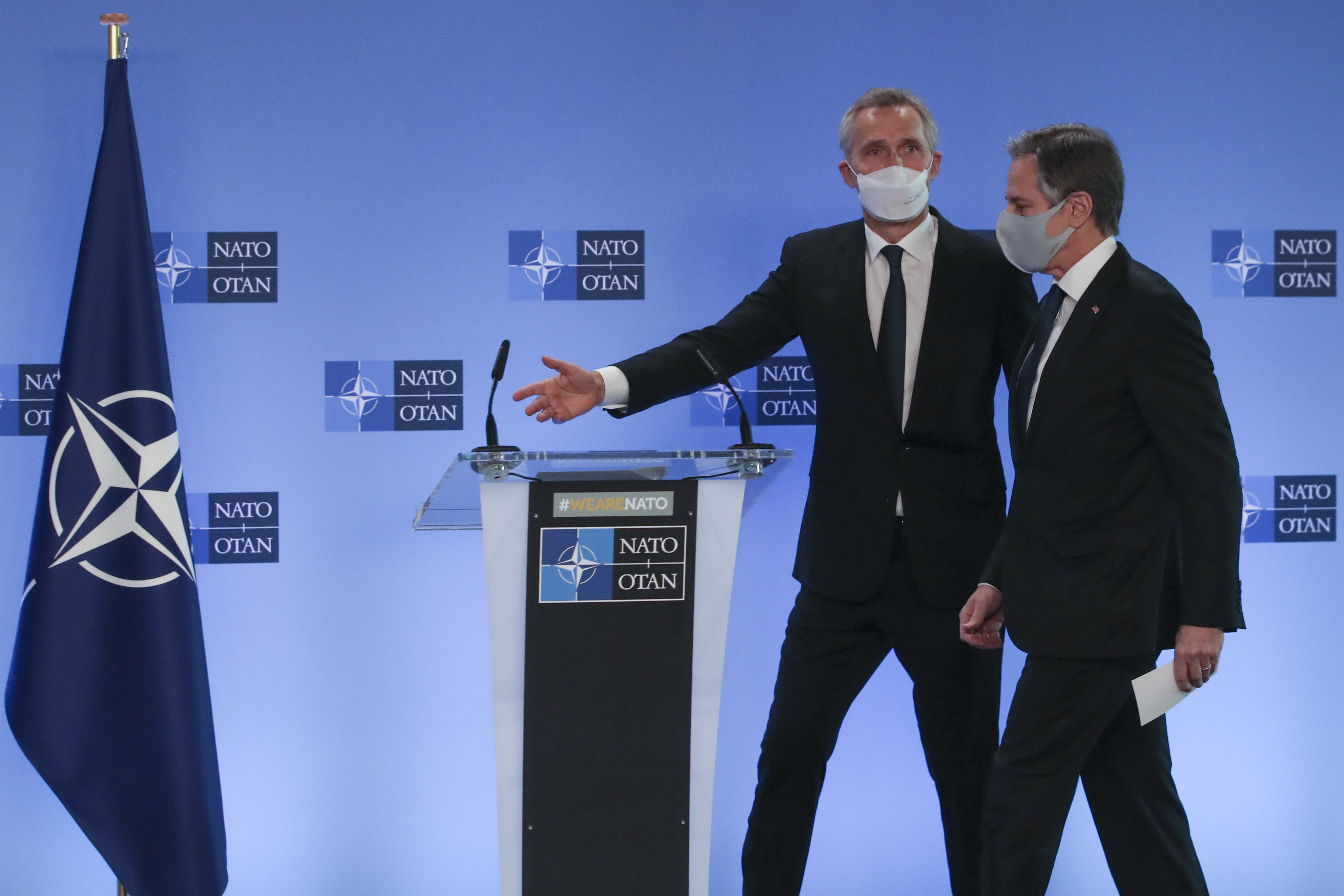 U.S. Secretary of State Antony Blinken, right, and NATO Secretary General Jens Stoltenberg arrive to give remarks prior to a NATO foreign ministers meeting at NATO headquarters in Brussels, Tuesday, March 23, 2021. (Yves Herman, Pool via AP)